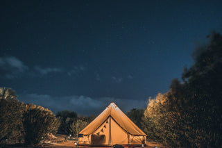 white retro tent under night sky elevated camping ideas