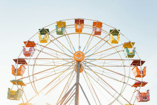 rainbow colored ferris wheel symbolizing summer ideas