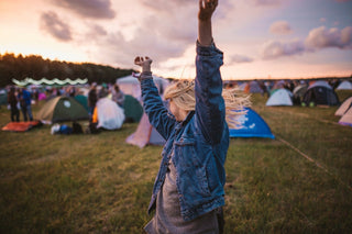 woman dancing at a festival campground experiencing a buzz without alcohol