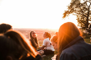 group of friends laughing from questions to ask while high