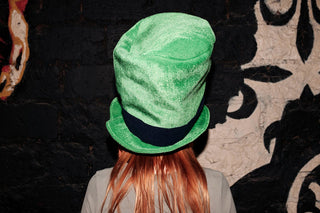 woman in green leprechaun hat participating in st patricks day activities