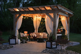 create a backyard oasis with a draped pergola seating area
